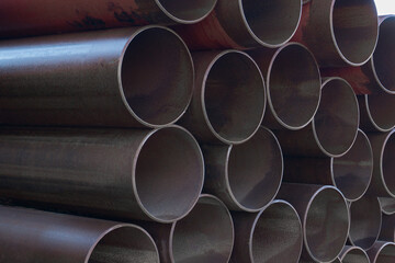 Bunch of metal pipes. Steel water pipes. Large steel pipes close up.