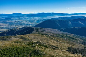Naklejka premium Polish mountains in Silesia Beskid in Szczyrk. Skrzyczne hill inPoland in autumn, fall season aerial drone photo