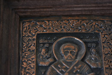 close-up religious image of metal in a frame 