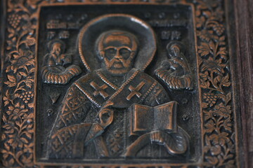 close-up religious image of metal in a frame 