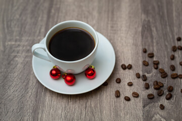 Coffee Cup with Christmas decorations on wooden table