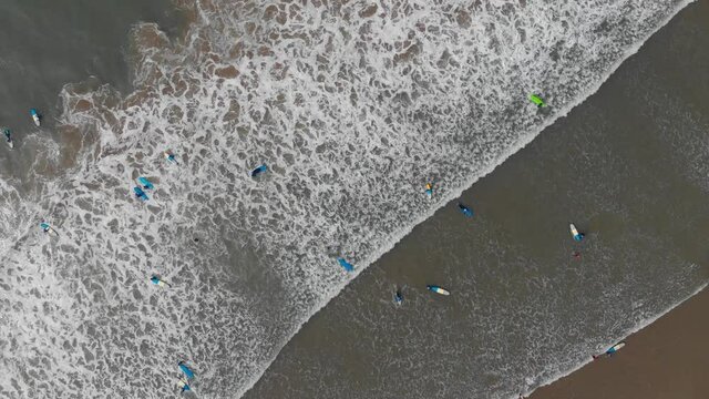 Overhead Aerial View Amateur Surfers In Sea Croyde Beach North Devon Colour Graded