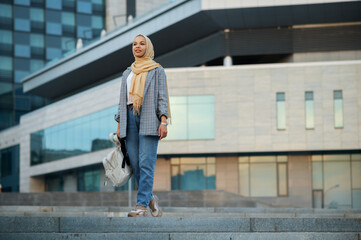 Arab female student at the building in downtown