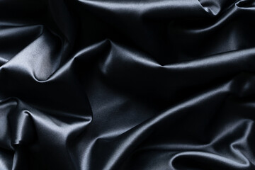 Obraz premium Abstract dark blue silk background and texture with folds.