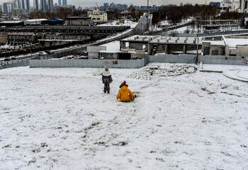 winter landscape in a city park after the first snow at the beginning of winter