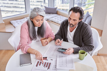 Couple calculating the family budget