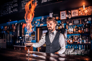 Barman formulates a cocktail in the porterhouse