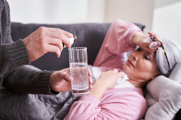Man dripping the potion into the water