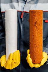 Water filtration - the plumber changes the dirty water filter. Cleaning of tap water