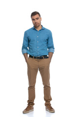 Fototapeta premium man with neutral mood sticking his hands in his pockets