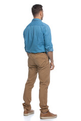 Fototapeta premium casual guy just standing and looking at something