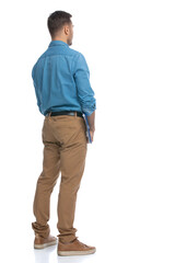 casual man standing against white background