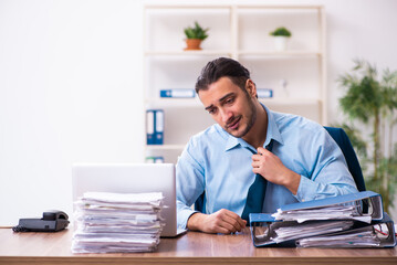 Fototapeta premium Young male businessman employee working in the office