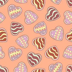 Doodle sweets in the form of hearts with decorative simple elements on pale pink background. Seamless tasty winter pattern. Suitable for wrapping, textile, wallpaper.