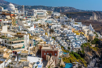 A close-up view of the white-painted buildings in Thira, Santorini in summertime