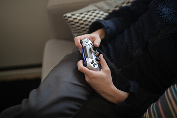 hands holding video game controller, Sweden