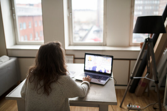 Woman using laptop, Sweden