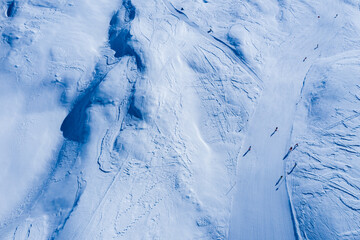 Drone image of mountains in winter. Image with snow, texture and shadows. 