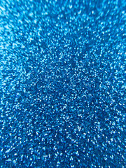 Navy blue abstract glitter vertical texture backdrop.
