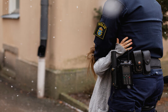 Police woman hugging daughter, Sweden