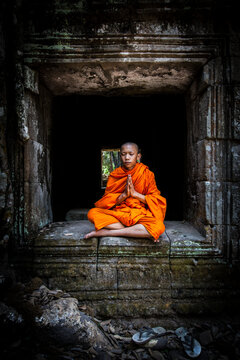 Novice monk meditating, Cambodia