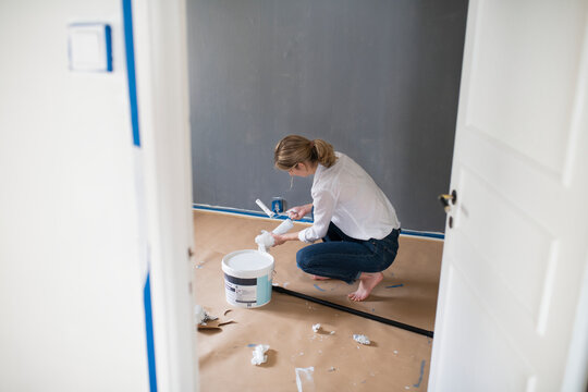 Woman preparing paint, Sweden