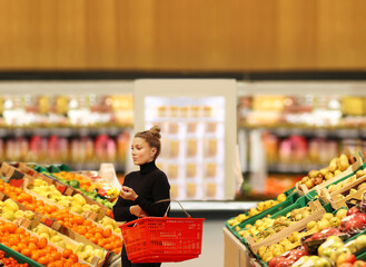 Woman buying fruits and vegetables at the market