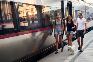 Friends on train station, Sweden
