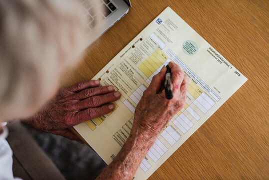 Woman filling documents, Sweden