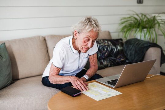 Woman reading documents, Sweden