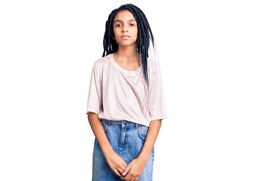 Cute African American Girl Wearing Casual Clothes With Serious Expression On Face. Simple And Natural Looking At The Camera.