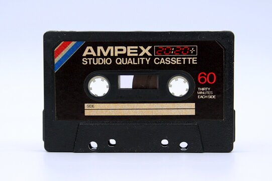 Amsterdam, the Netherlands - April 12, 2019: Ampex audio cassette tape against a white background.