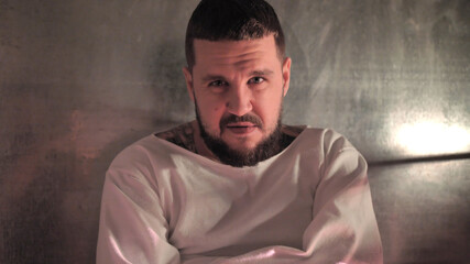Obraz premium Psycho, crazy man in a straitjacket in a psychiatric hospital, creepy