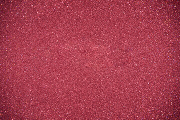 Glitter red background. Photo of monotone shiny background.