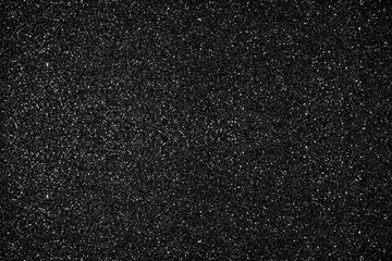 Glitter black background. Photo of monotone shiny background.