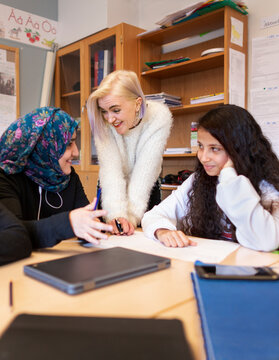 Teacher and students in classroom, Sweden