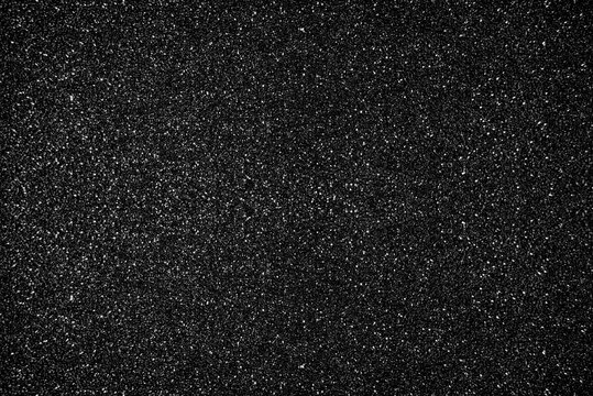 Glitter black background. Photo of monotone shiny background.
