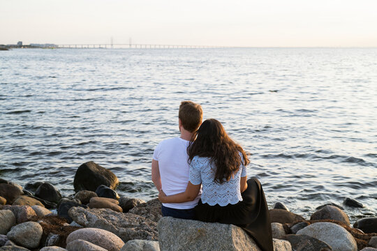 Young couple looking at sea, Sweden