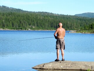 Senior fishing by the lake