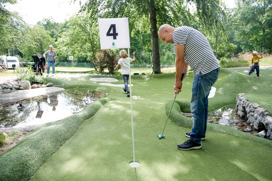 Man playing mini golf, Sweden