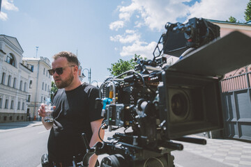 Director of photography with a camera in his hands on the set