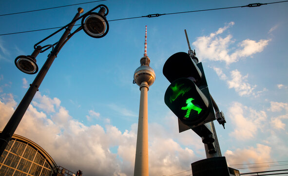 Green Ampelmann (Ampelm&auml;nnchen) on Berlin Traffic Light with Berlin TV Tower in background (Berliner Fernsehturm) August 14th 2017, Berlin, Germany