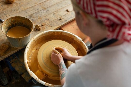 Woman making pottery, Sweden