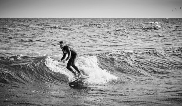 Man surfing wave, Sweden