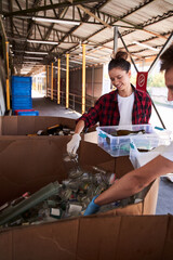 Woman holding plastic container with wastes