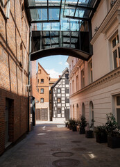 Fototapeta premium House in Bydgoszcz. Ancient building above the canal. Red brick building. Architecture. Architecture in the Polish city of Bydgoszcz.