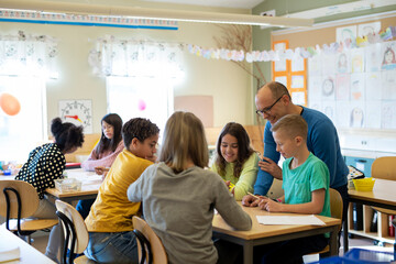 Teacher with children in classroom, Sweden