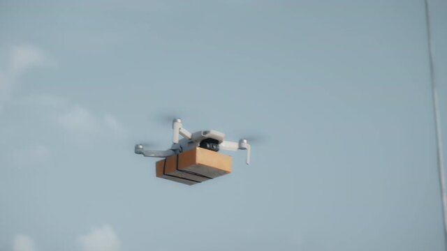 flying on a sky delivery drone with holding a .cardboard parcel
