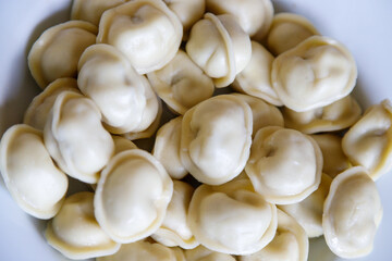 Boiled dumplings on a white plate