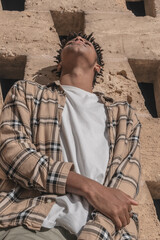 African American black man posing in front of a wall